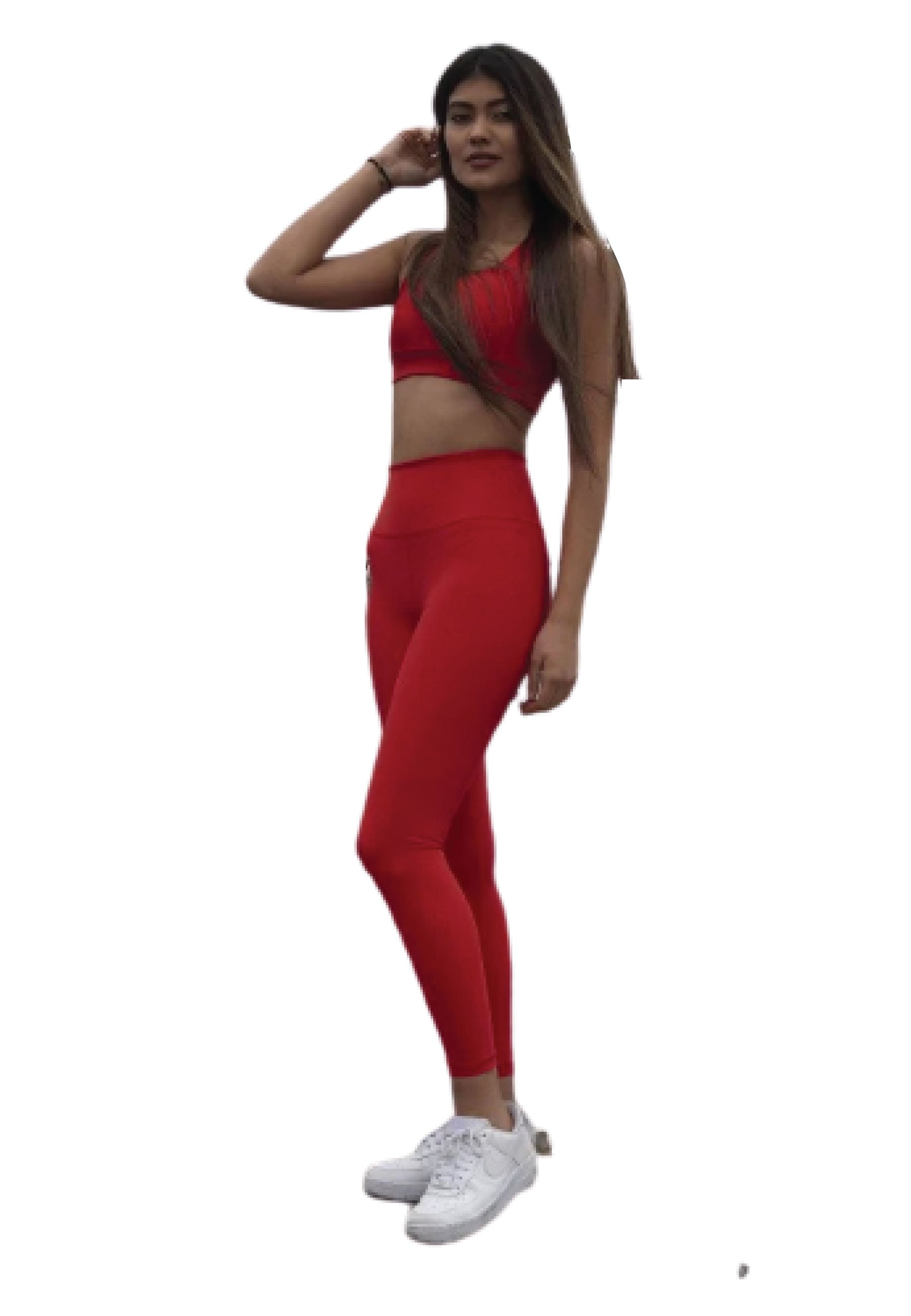 Frau trägt Lisminas 252 Extra High Waist Leggings in Rot mit weißen Sneakers vor weißem Hintergrund.